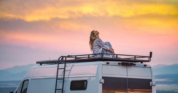 kristi sitting on top of a van epic trails backpacking hiking sunset photography landscape