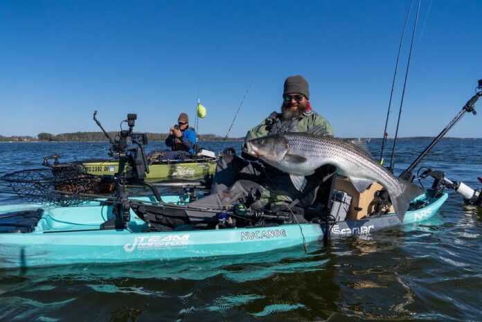 Jameson Redding catching striped bass Kent Island MD